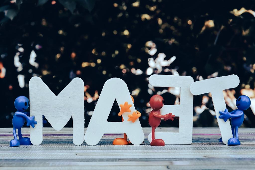 Illustration showing a diverse team collaborating on computer systems